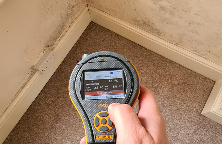 humidity meter being used in a free condensation survey